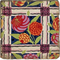 Load image into Gallery viewer, Floral-patterned coaster with purple, yellow, orange and red on navy and ivory background.
