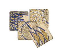 Load image into Gallery viewer, Set of four patterned coasters with blue and gold designs on a white background.