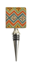 Load image into Gallery viewer, Wine bottle stopper with decorative zigzag pattern in shades of rust, gold, blue, green and ivory.