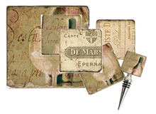 Load image into Gallery viewer, Decorative wine bottle stopper, trivet and coasters with vintage-style labels on a textured background