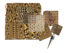 Load image into Gallery viewer, Set of coasters, cork back trivet and bottle stopper with black, beige and brown woven  pattern on textured background.
